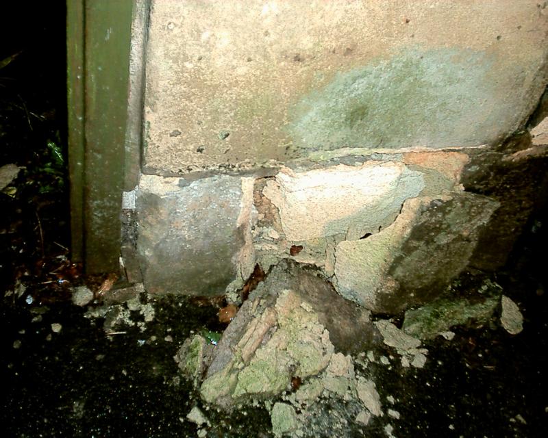 Close up, damage to bottom of wall