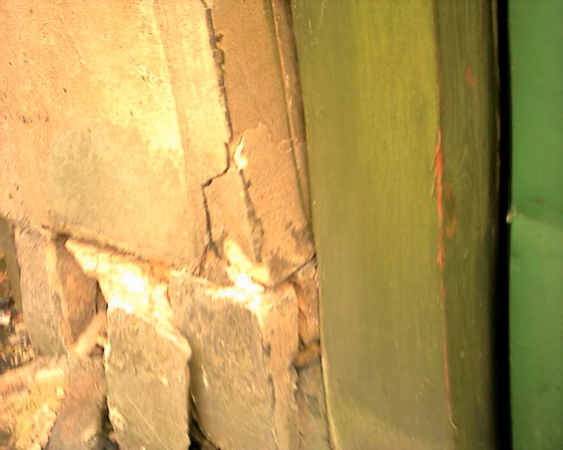 Wall damage showing red paint marks